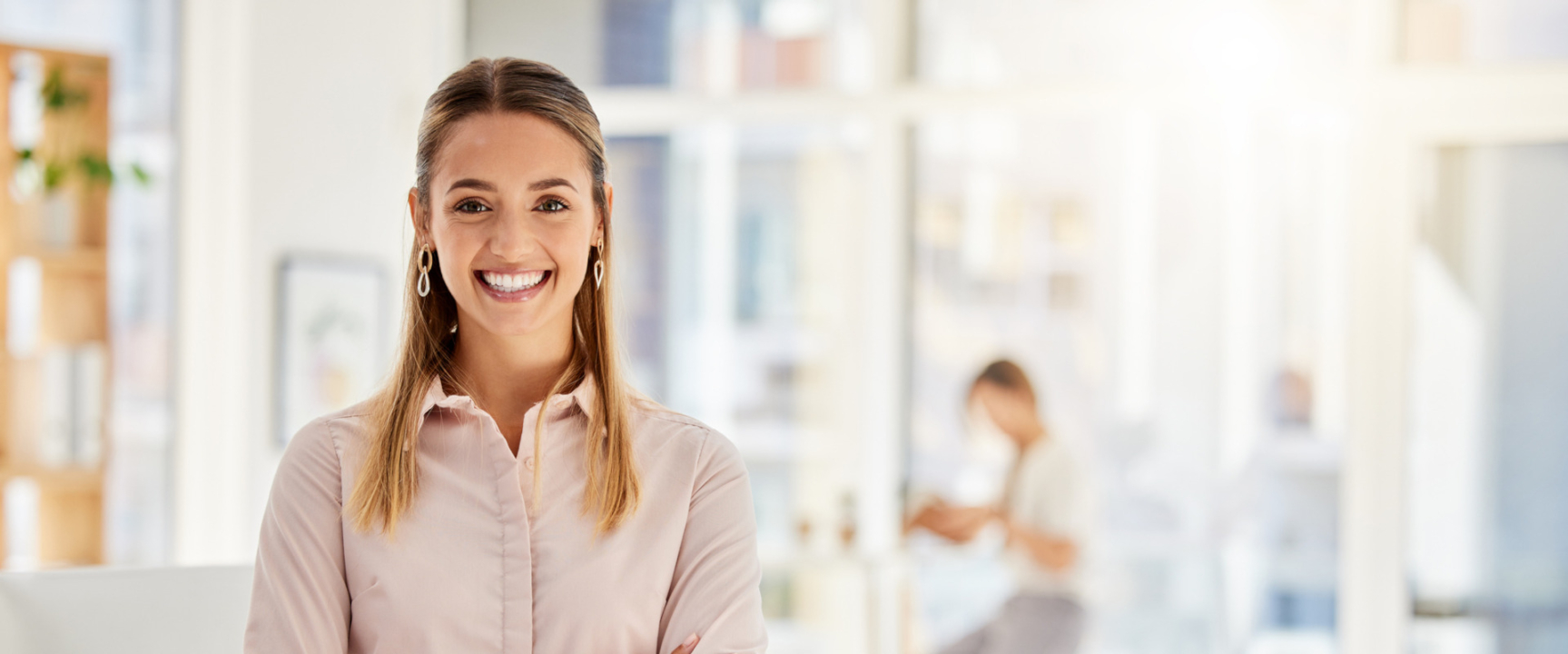 Happy, business leader and woman with a smile in success with crossed arms in a light office. Portrait of a professional and confident white female employee in leadership and management at a company